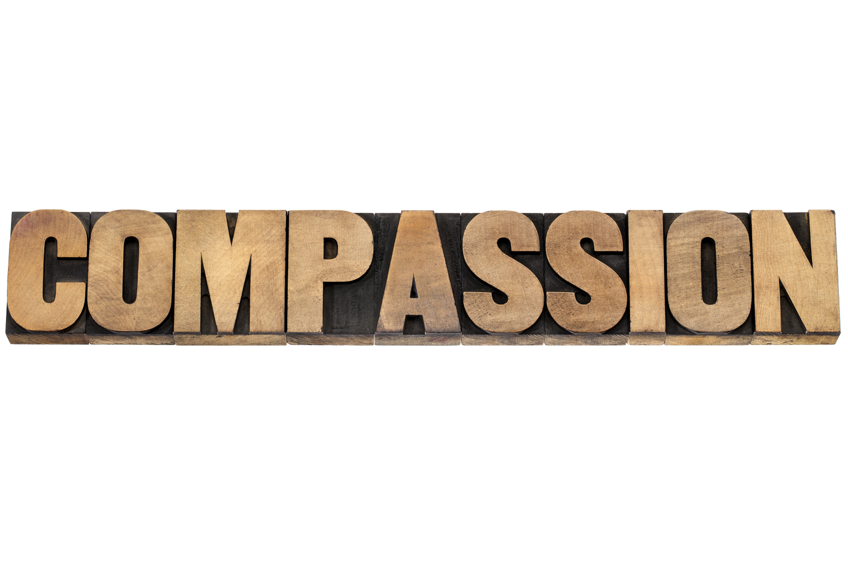compassion word in wood type